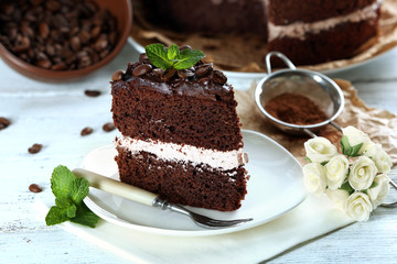 Delicious chocolate cake on table close-up