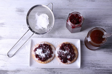 Delicious cookies with jam and powdered sugar