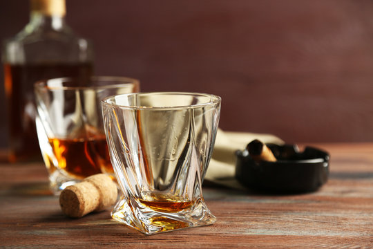 Whiskey on wooden background