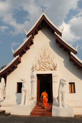 the monks enter a beautiful buddhist chapel