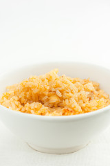 close up of risotto in a white bowl, room for text