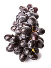 Black grapes over white background