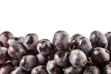 Black grapes over white background