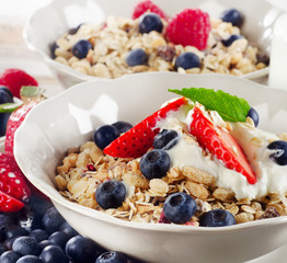 Healthy Breakfast with ripe fresh berries  and  muesli.