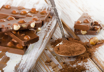 Cocoa Powder and Chocolate on  wooden table