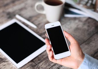 Modern workplace with digital tablet computer and mobile phone