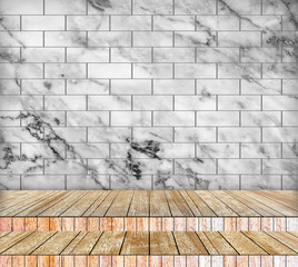 Backdrop marble wall and wood slabs arranged in perspective.
