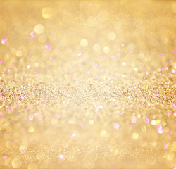 glitter vintage lights background. abstract gold background . de