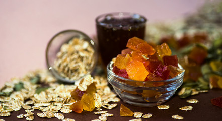 Candied papaya, cereals, pumpkin seeds and honey for breakfast