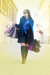 Woman carrying bags after shopping