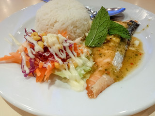 fish steak grilled spicy with rice and salad