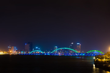 Fototapeta na wymiar Turquoise Dragon bridge with city view Danang Vietnam