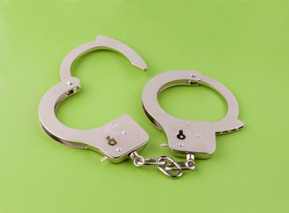Steel handcuffs on a white background