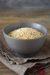 Sesame fried in a bowl on the boards