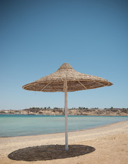 Tropical beach with umbrella