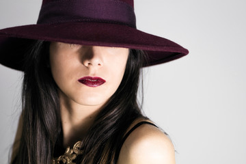 portrait of beautiful glamour woman with burgundy hat
