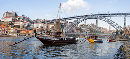 The Rabelo Boats and the Dom Luis I Bridge. Porto, Portugal - obrazy, fototapety, plakaty