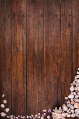 Obraz na płótnie Canvas wooden deck background seashells, summer sea vacation concept