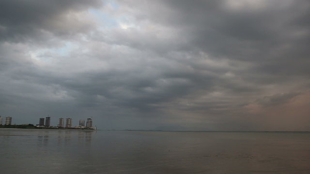 city view from edge of bay during low tide	