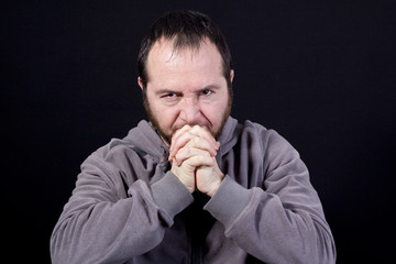  portrait of thoughtful sad young man isolated on black backgrou