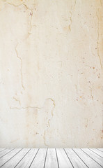 Backdrop sandstone wall and wood slabs arranged in perspective.