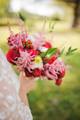 Bride holding a bouquet of beautiful roses