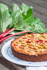 Homemade rhubarb pie on wooden table.