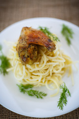 Chicken wings fried with noodles