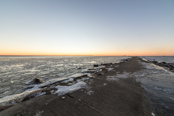 sunset over frozen sea