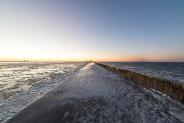 sunset over frozen sea
