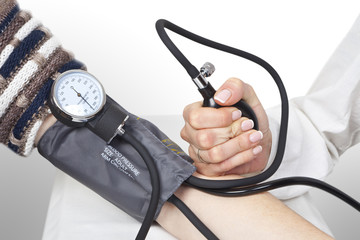 doctor measures pressure in the patient