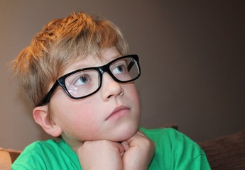 Young pensive boy in glasses