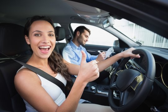 Young woman getting a driving lesson