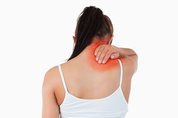 Back view of woman with pain in her neck