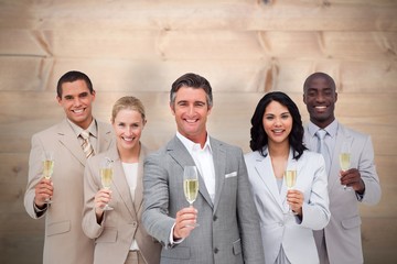 Business team celebrating a success with champagne