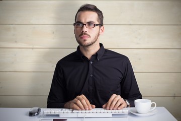 Focused businessman with glasses using computer