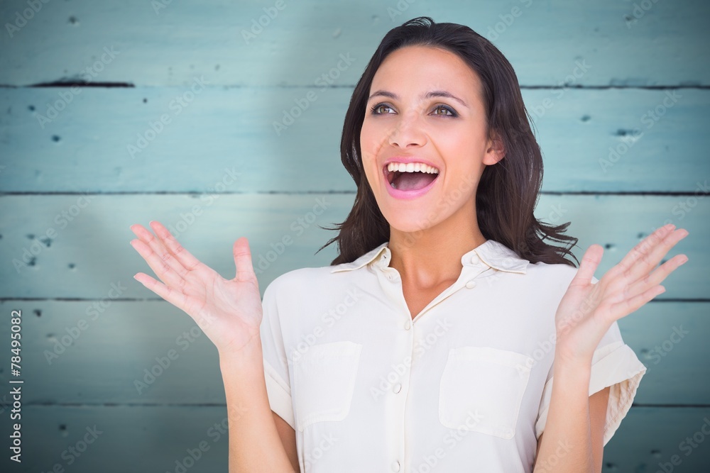 Poster composite image of surprised brunette with hands up