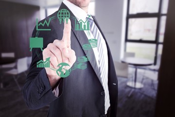 Composite image of businessman pointing with his finger