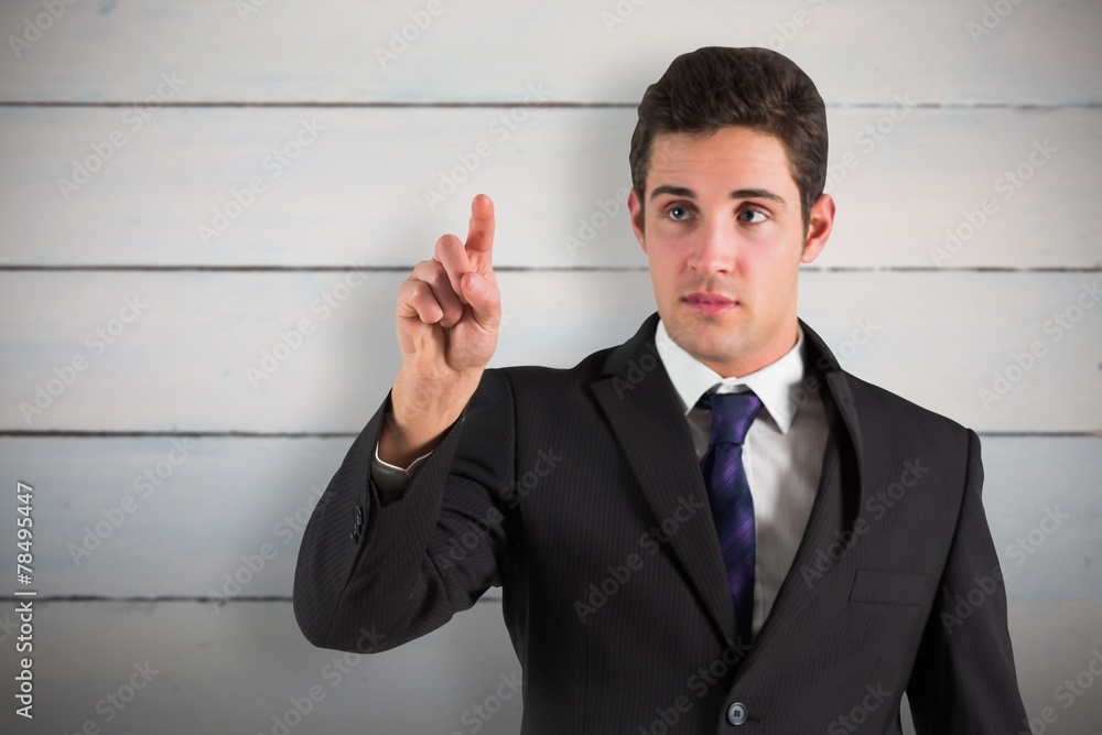 Poster Composite image of businessman standing and pointing