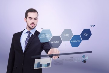 Composite image of cheerful businessman pointing at camera