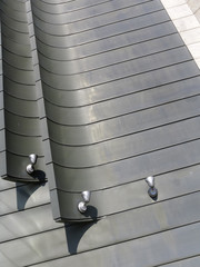 Halogen metal reflectors on modern building grey wall