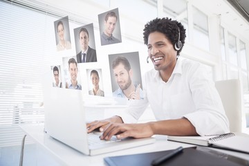 Happy businessman working at his desk