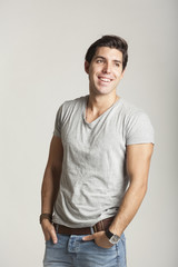 joyful man jumping gray background