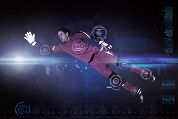Composite image of fit goal keeper jumping up
