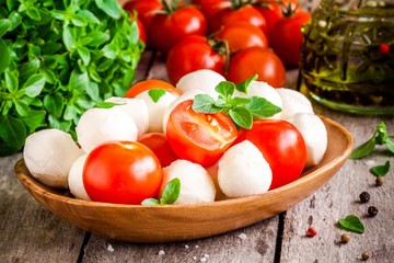 mozzarella, organic cherry tomatoes, fresh basil and olive oil