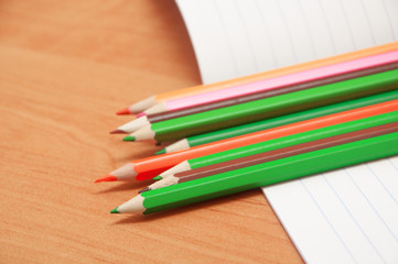 Obraz premium pencils on notebook