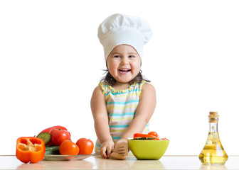 cook kid girl preparing vegetables
