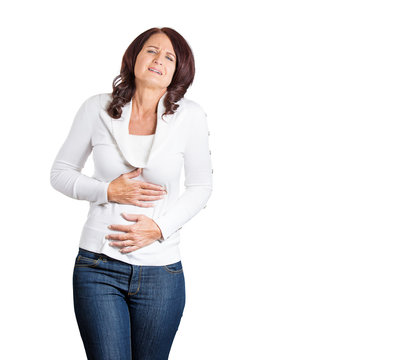 stressed woman hands on stomach having bad stomach aches pains