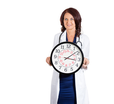Female doctor healthcare professional holding wall clock
