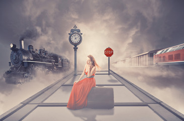 Obraz na płótnie Canvas woman waiting old train on platform railway station talking on p